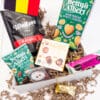 Inhoud Best of Belgium Box Medium: Waltson chips, jungle nuts, pralines, Baru en Gentse cuberdons